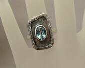Handmade sterling silver ring with sky blue topaz