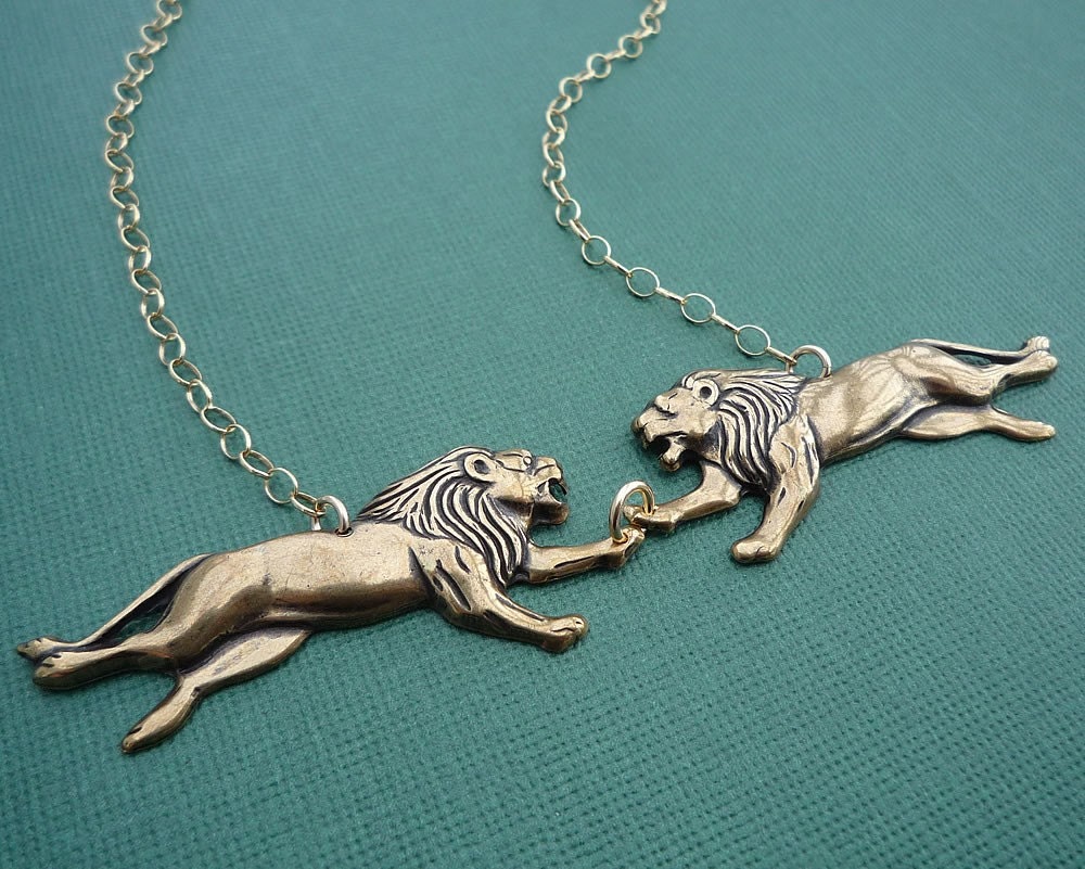 the lion twins necklace in gold