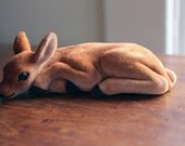Felt laying deer figure