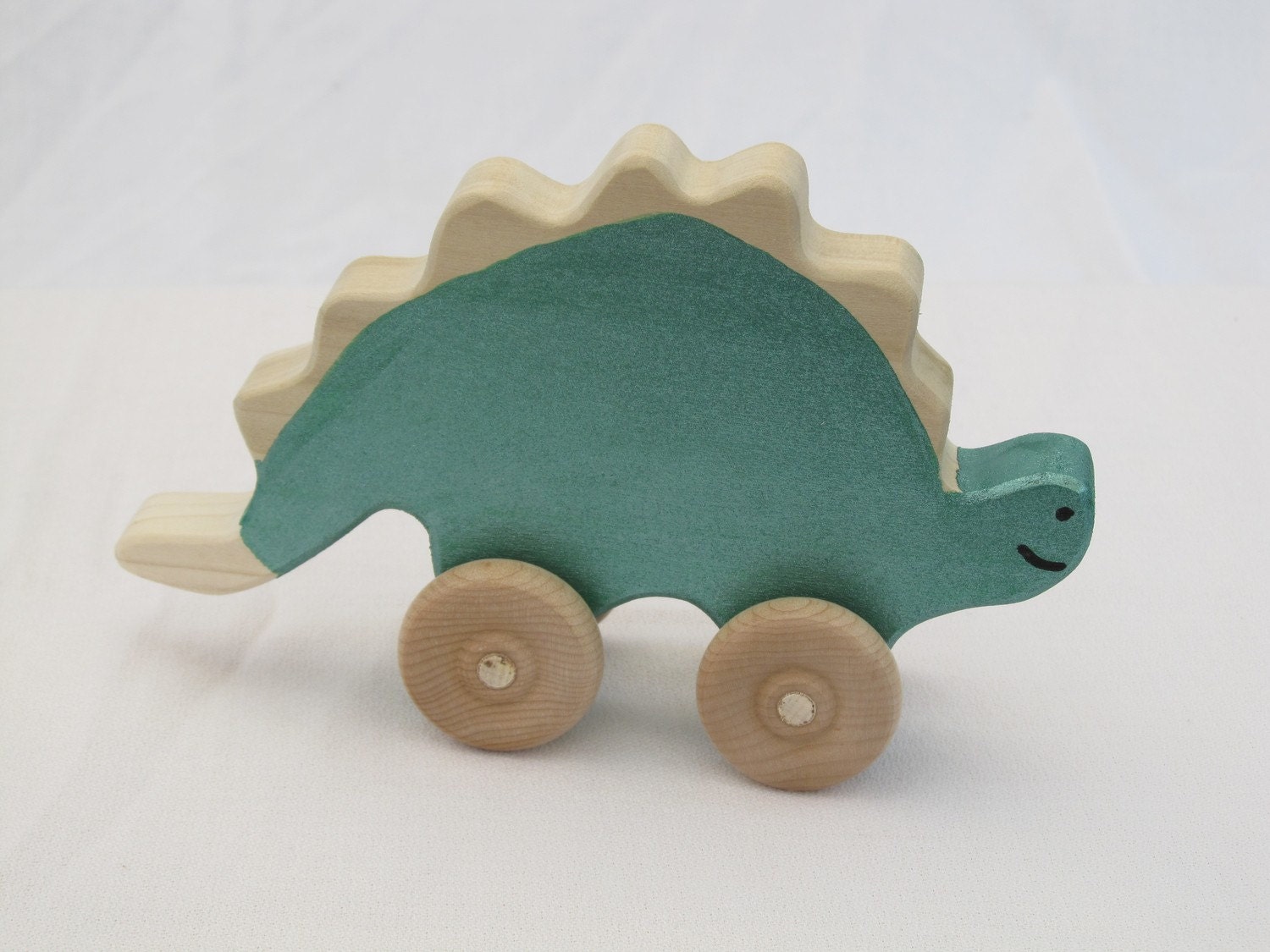 Stegosaurus Rollimal - a baby/toddler wooden toy animal