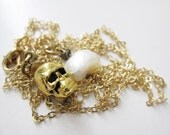 Goldie the Golden skull and pearl necklace