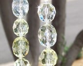 clear and light yellow necklace with charcoal jersey