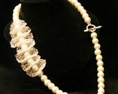 Handmade bridal necklace with Swarovski pearls set in crochet silver shells
