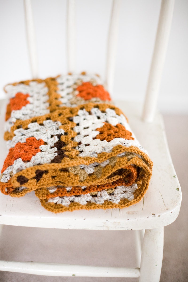 baby crib afghan in orange and other natural colors