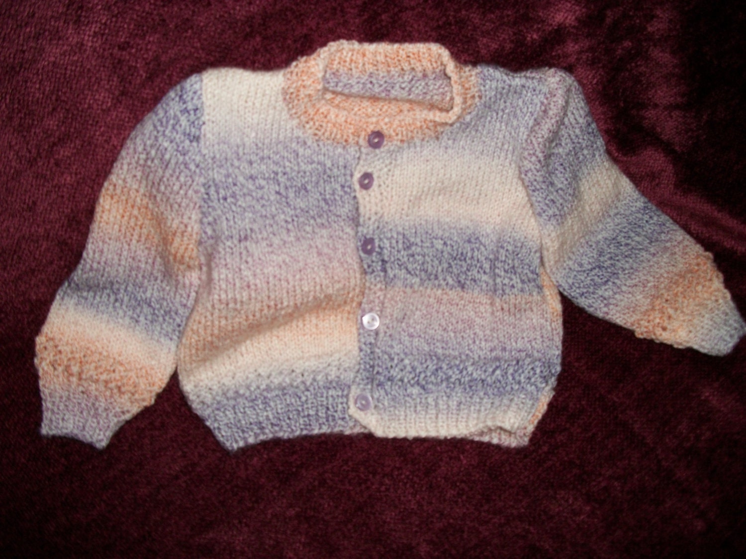 Knitted Baby cardigan with lacy insert