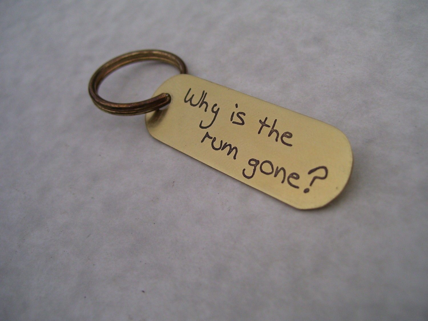 Why is the Rum gone     Brass Keychain