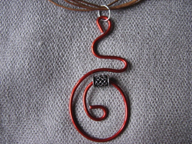 Rust orange brown wire pendant.