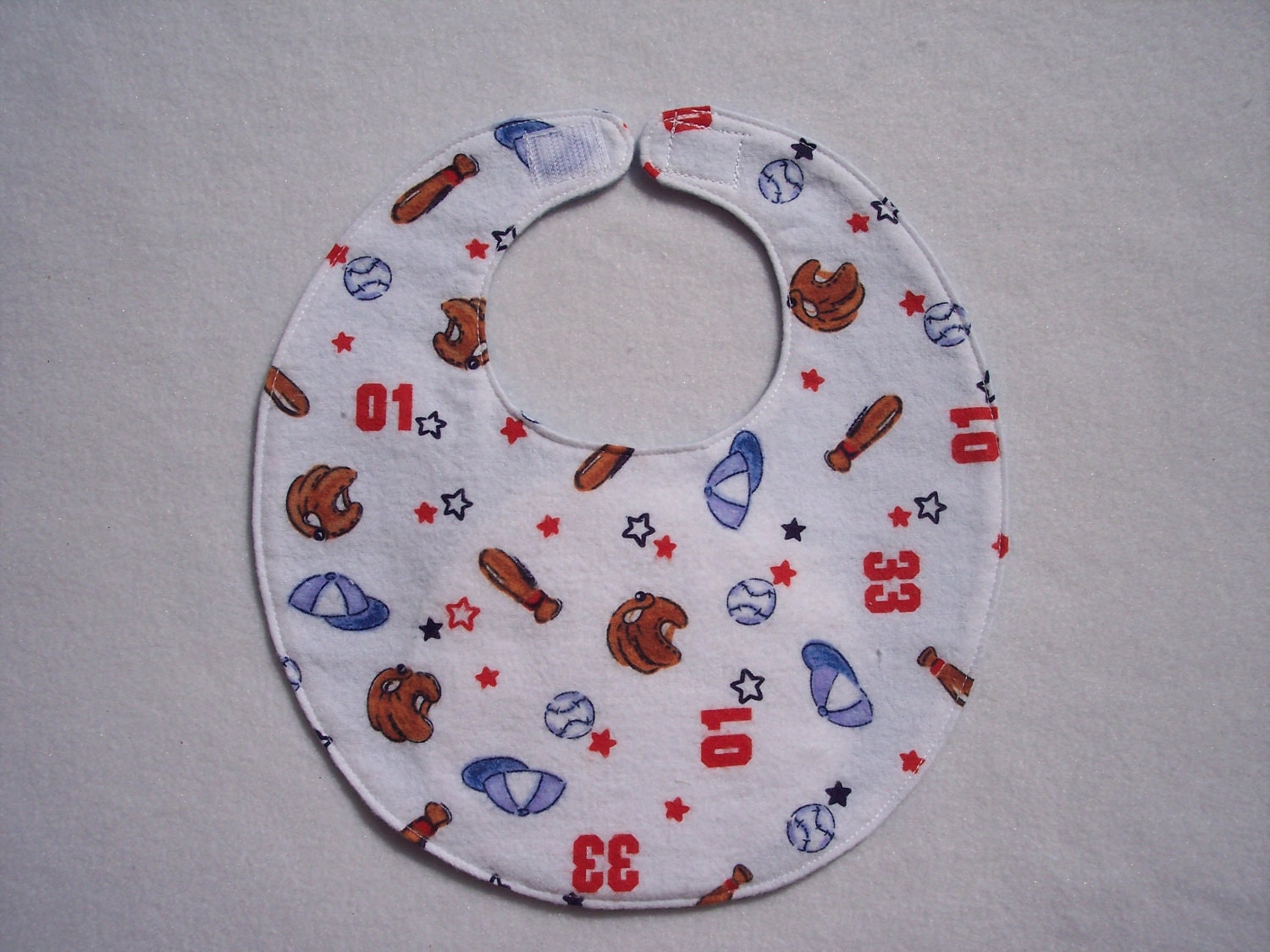 Baby bib, four soft layers, reversible, white with red & blue baseball motif