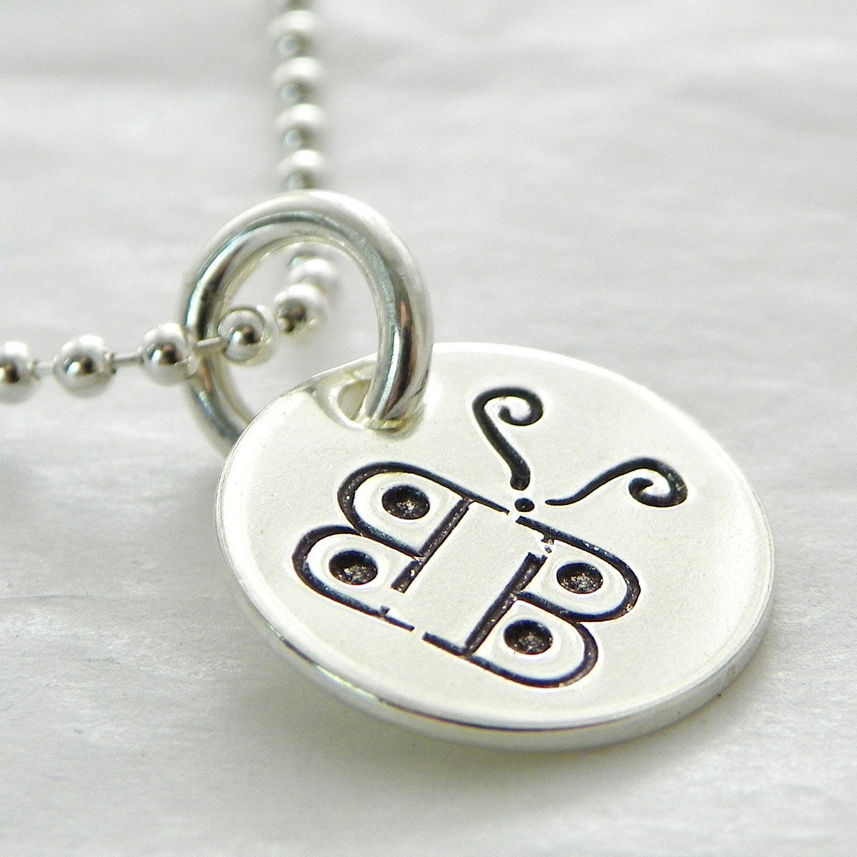 Hannah's Itty Bitty Butterfly hand stamped sterling necklace
