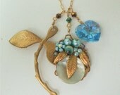 Vintage charm necklace with Swarovski crystal heart, vintage leaf charm & "recycled"  clip-on earring from the 1940's as focal piece