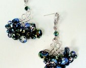 Matte silver vermeil chandelier earring with mistic blue and green crystals artfully woven with open work ear pad and sterling silver post.
