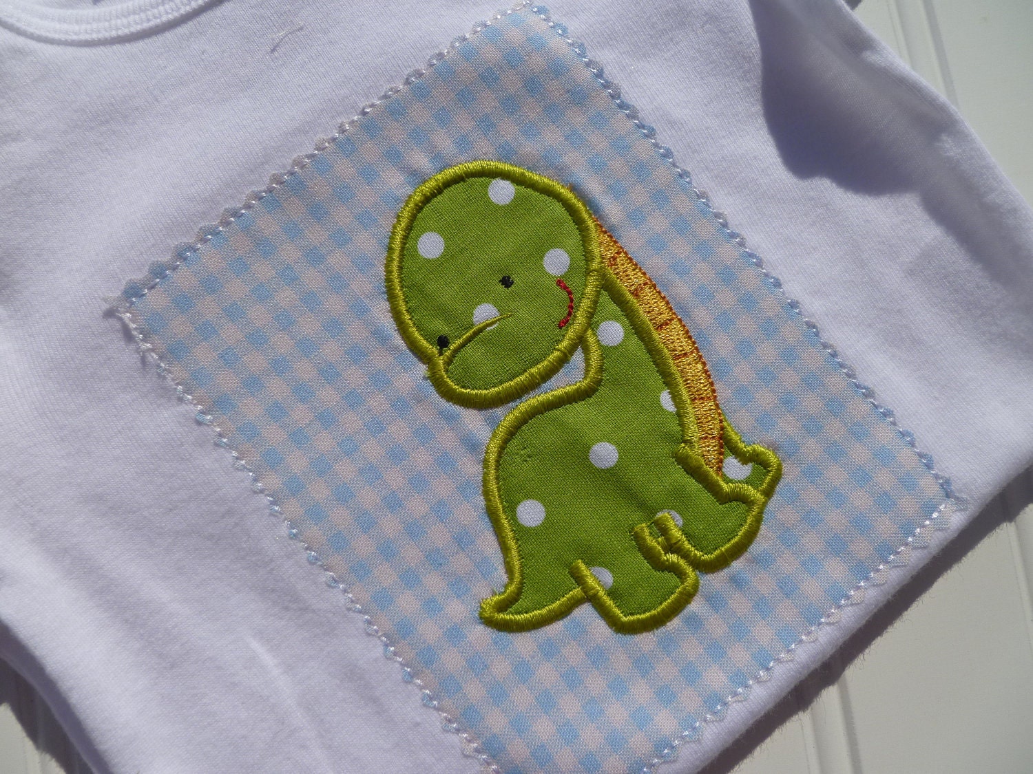 Baby Bodysuit, Embroidered Boutique baby clothes with Dinosaur by Jennifernoeldesigns on Etsy