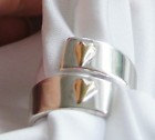 Silver Adjustable ring with 2 gold hearts.US Size 7 3/4 ( UK Size P)