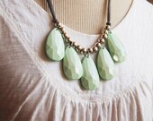 mint green with grey necklace