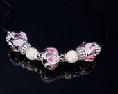 Pink and black glass bead necklace