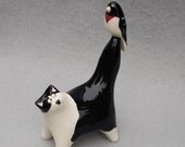 Handmade ceramic cat with rosebreasted grosbeak