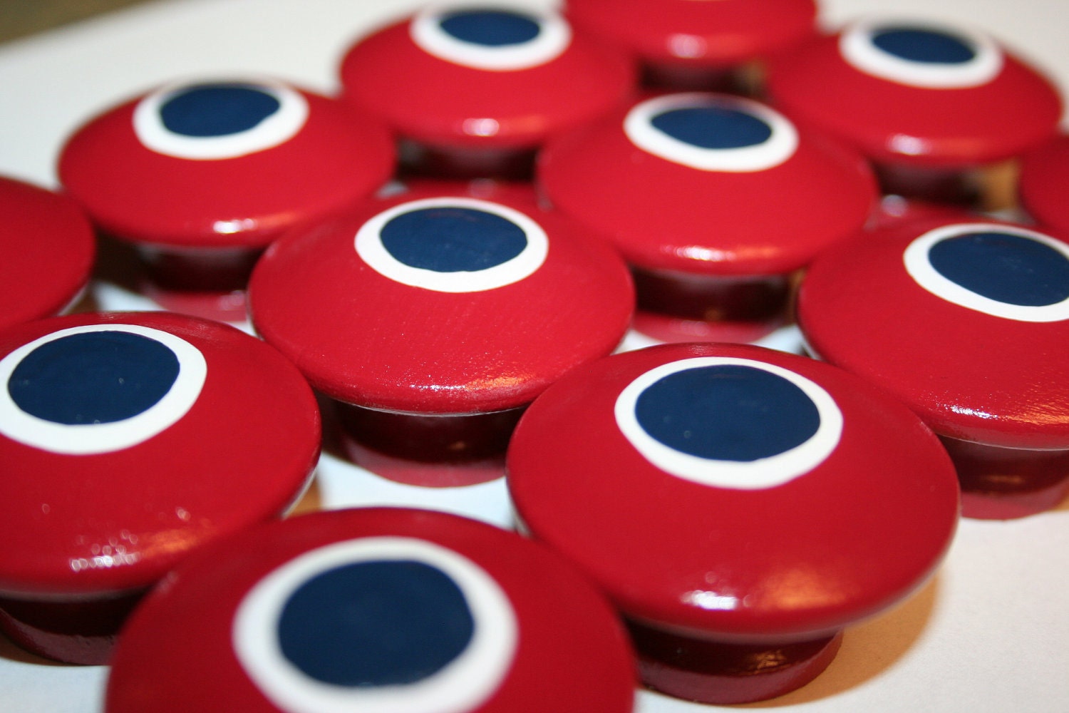 Red with a Navy Blue Polka Dot Surronded by a White Polka Dot Knob