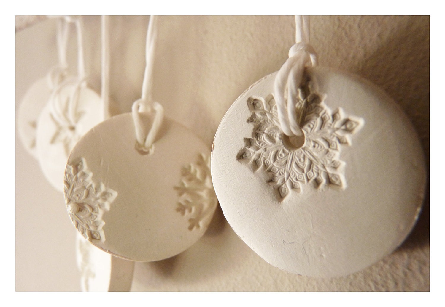 5 Porcelain winter white & pearl snowflake ornaments.