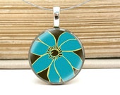 chic blue flower necklace on repurposed coin pendant