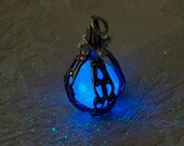 Mermaid's Magic Midnight Blue - Caged Pendant with Glowing Essence of the Sea - Amazing Glow in the Dark Effects