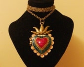 Unusual circus-style colourful heart-shaped locket on an antique-brass-tone chain