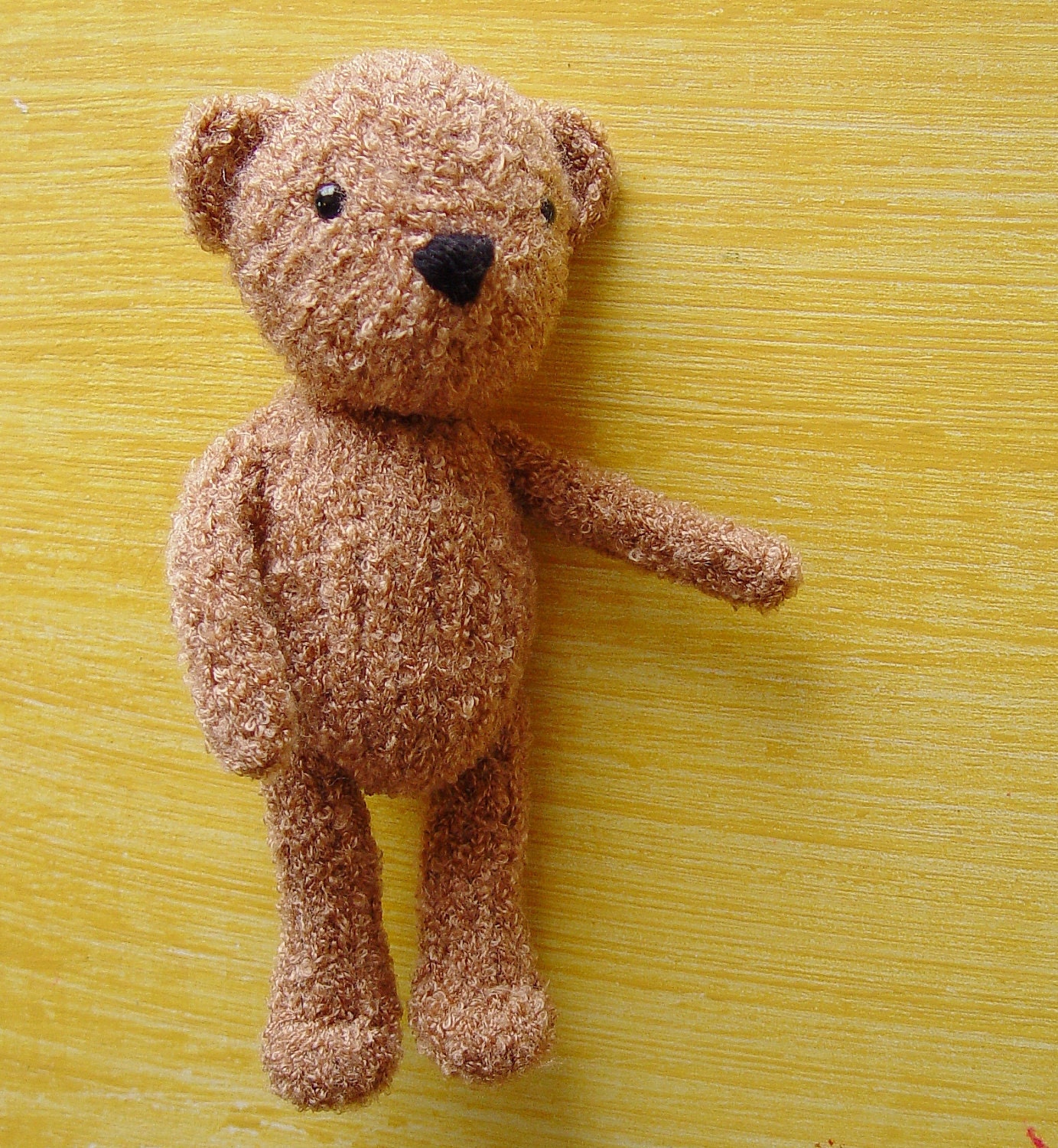 Little knitted bear in light brown