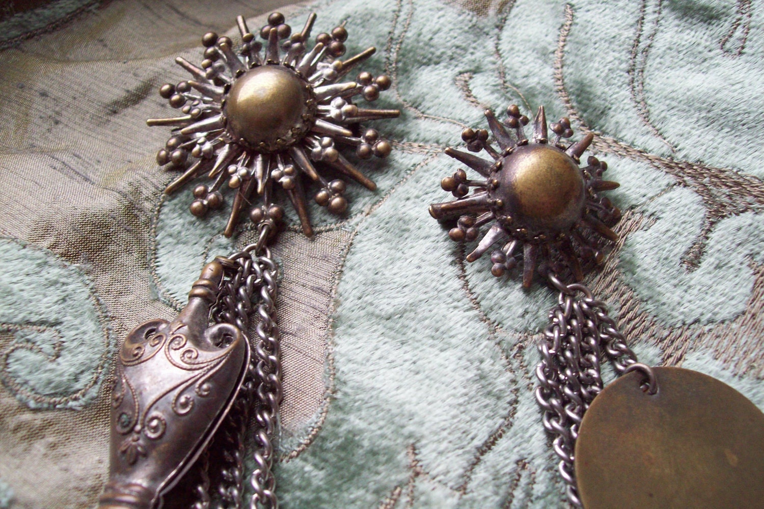 Sweater clip with victorian 50s satellite chatelaine theme