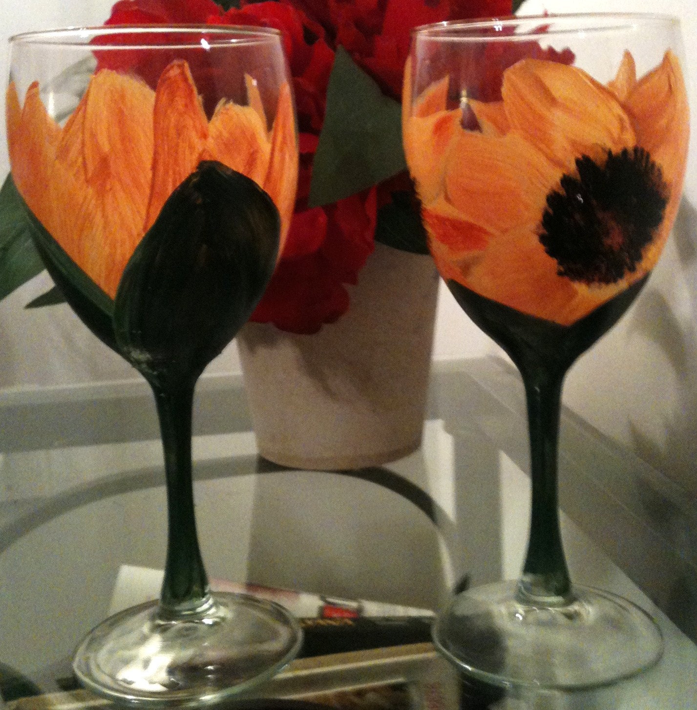 A pair of hand painted sunflower wine glasses
