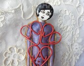Figure with Heart Embellishments