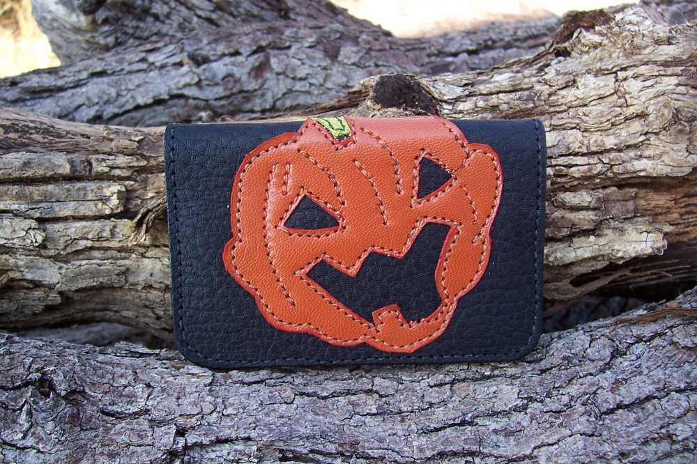Orange pumpkin stitched black leather wallet great for Halloween or everyday