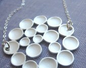 Matte silver fancy bubble pendant on silver plated chain
