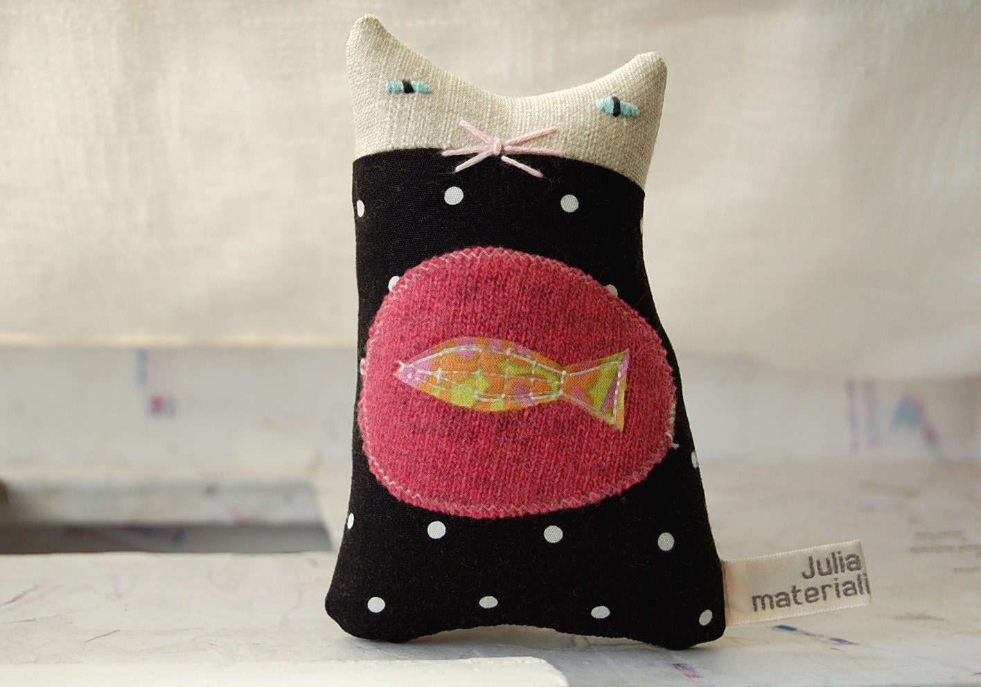 A small ornamental textile cat called Lois