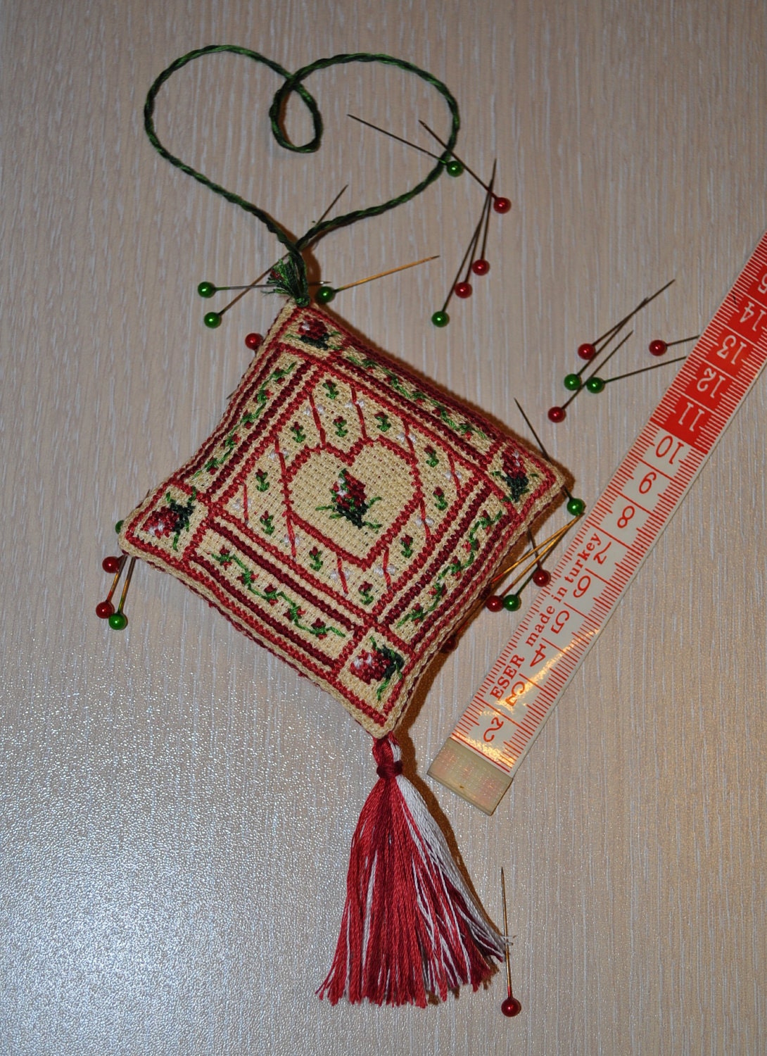 Completed cross stitch Biscornu Pincushion