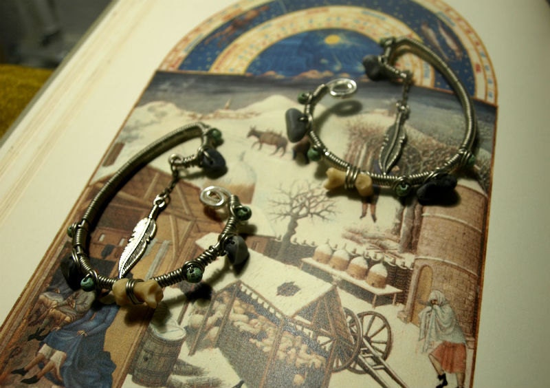Badger toe bone, magnesite, marble, and a feather - ear weights