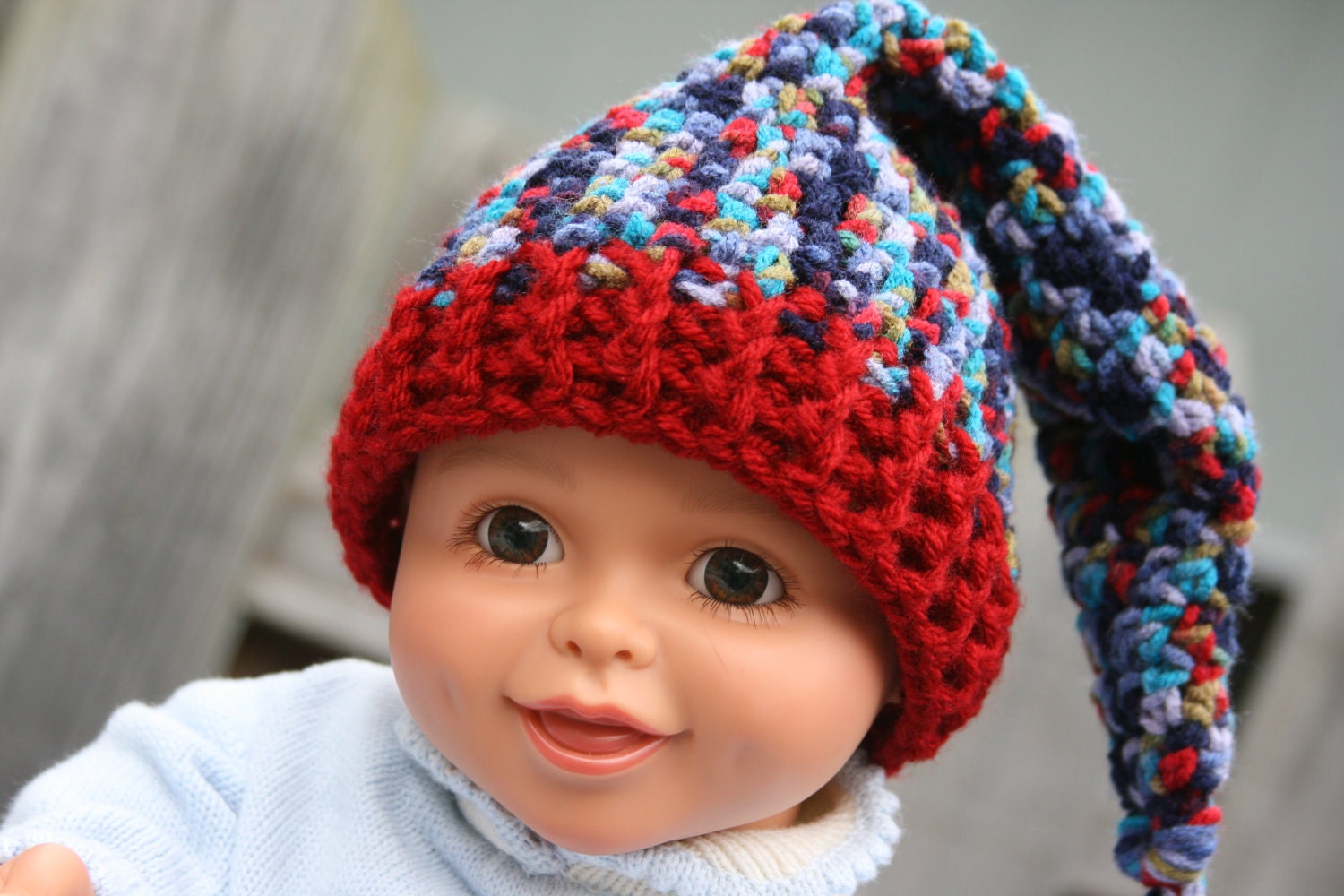Baby newborn stocking cap elf hat crochet with xtra braid long in mulitcolor neautral in blue, red, purple black. 0-3 months