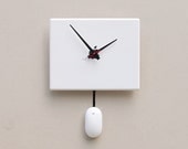 Clock created from a recycled Apple ibook laptop cover