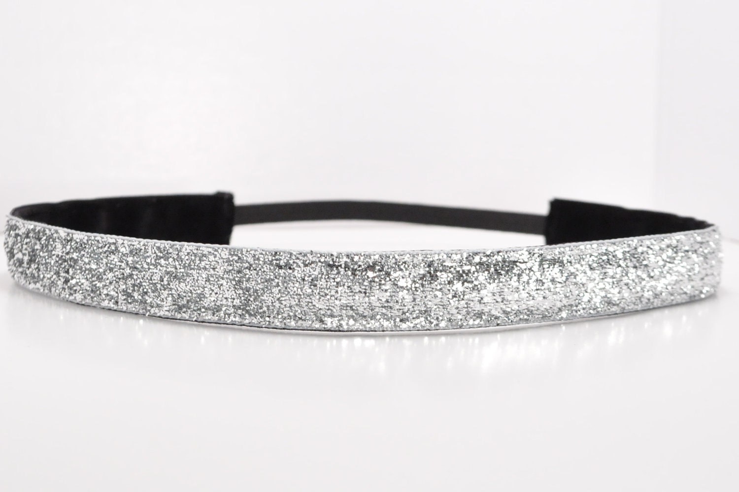 Band-It Headband.... Silver Glitter.  Will stay put and not slip.