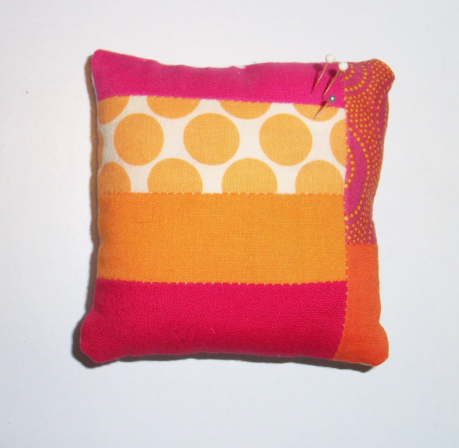 Orange and pink patchwork pincushion