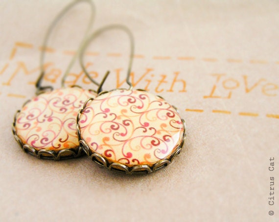 Red orange swirls earrings in antique brass