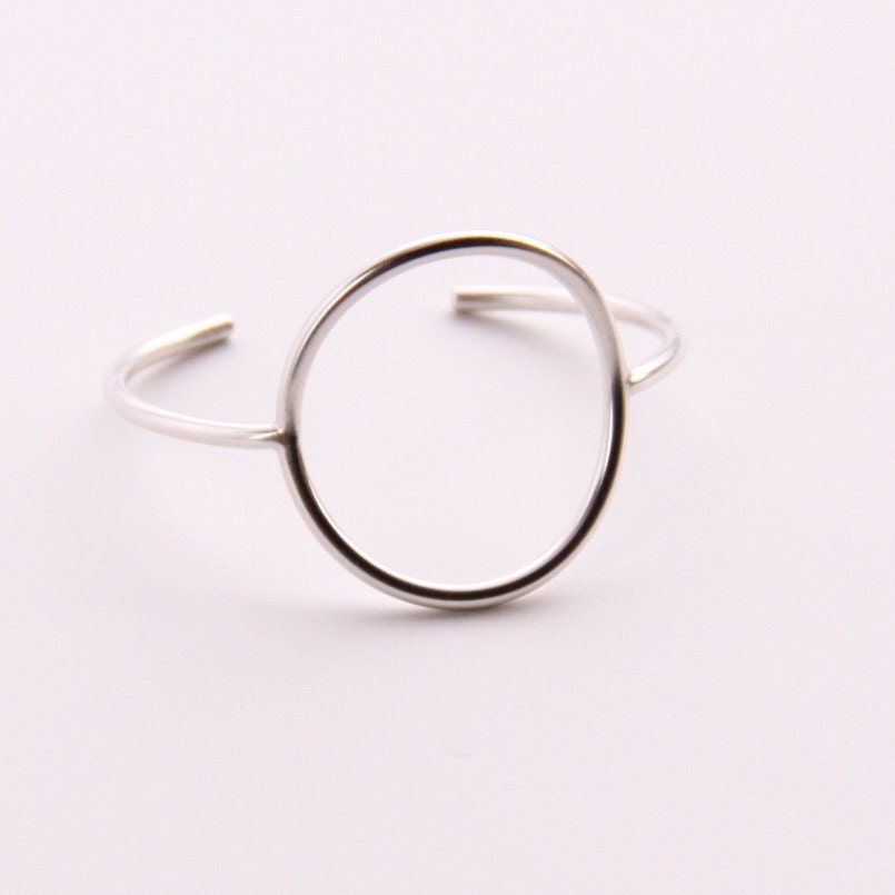 Minimalist silver bracelet of a focal circle shape forged, soldered and hand formed into comfortable, elegant wrist jewelry - "Centre Cuff"
