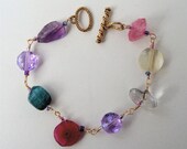 Beautiful and feminine natural gemstone bracelet consisting of faceted Pineapple Quartz, Amethyst, Green Tourmaline, Pink Quartz