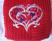 Red towel with elaborate heart for your kitchen