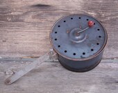 Antique distressed metal primitive popcorn maker with red wooden knob-extra long handle