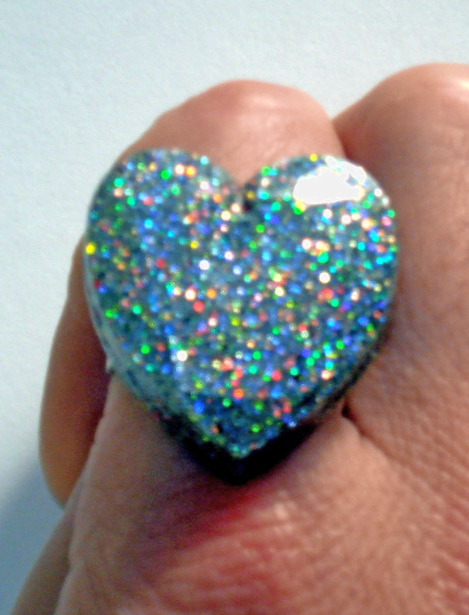 Silver glitter gemstone shape heart with a hint of multi-colored sparkle ring