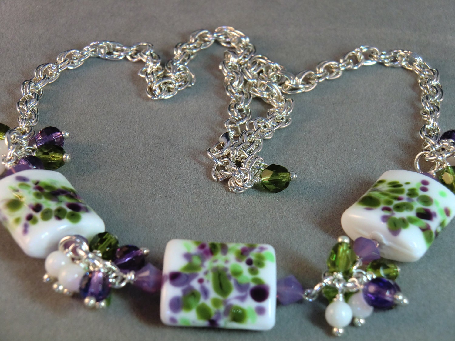 Green and purple Monet's Garden lampwork necklace in white and silver, purple, green, and white lampwork necklace - wilywolverine