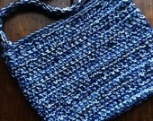 Crocheted bag in white and multicolored blue hues