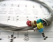 Recycled FENDER Electric Guitar String Bracelet silver colored with colored ball ends attached Mens or Womens MEDIUM