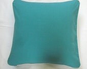solid sea green throw pillow cover with cream piping