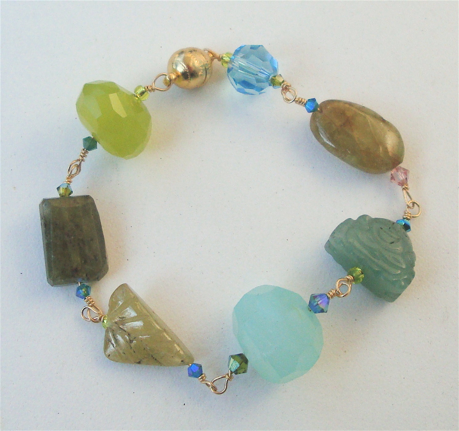 Beautiful and feminine natural gemstone bracelet consisting of Pineapple Quartz, Moss Agate, Jade and Swarovski Crystals.