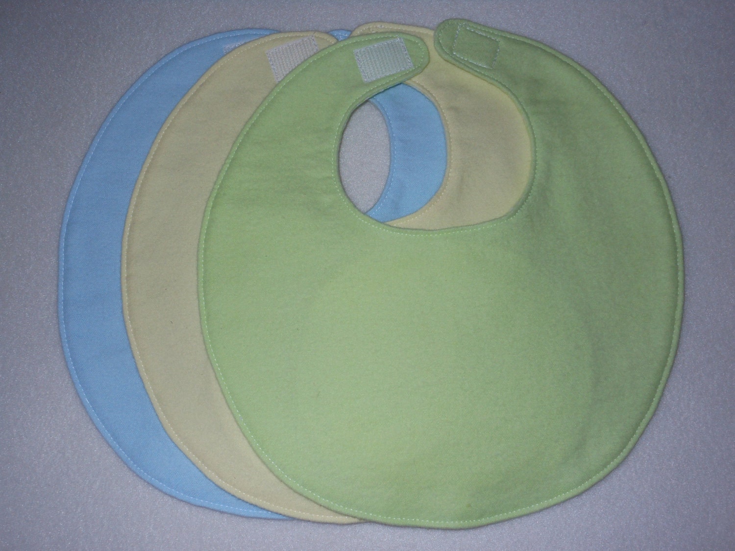 Baby bib, four soft layers, reversible, three pack, solid colors